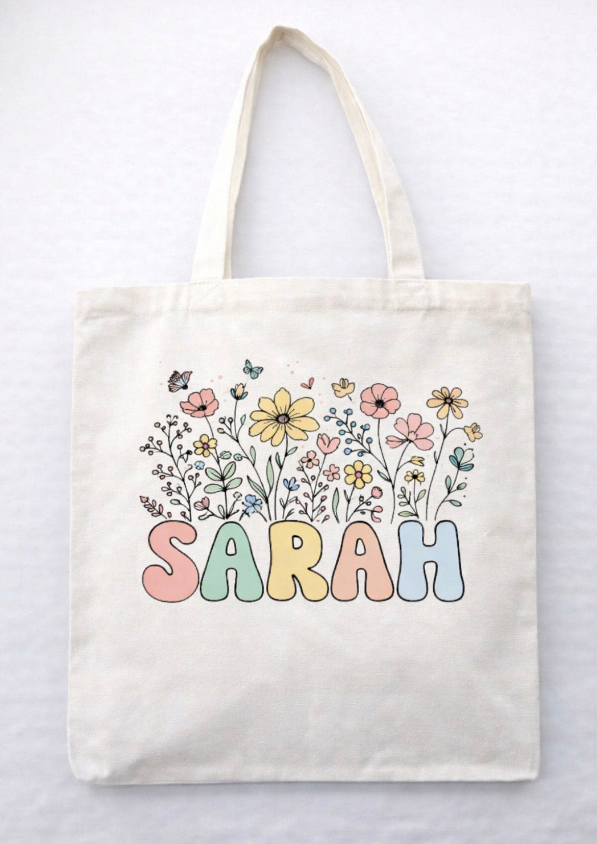 Tote bag with 'Sarah' and floral design on a white background