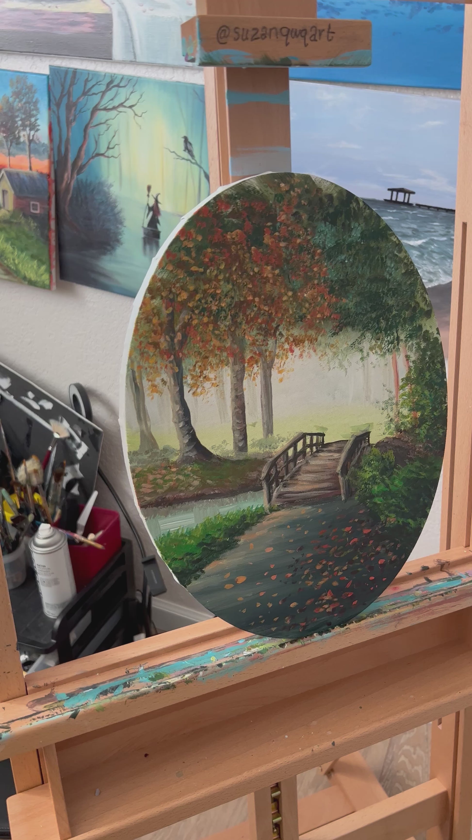 Autumn landscape painting on an oval canvas